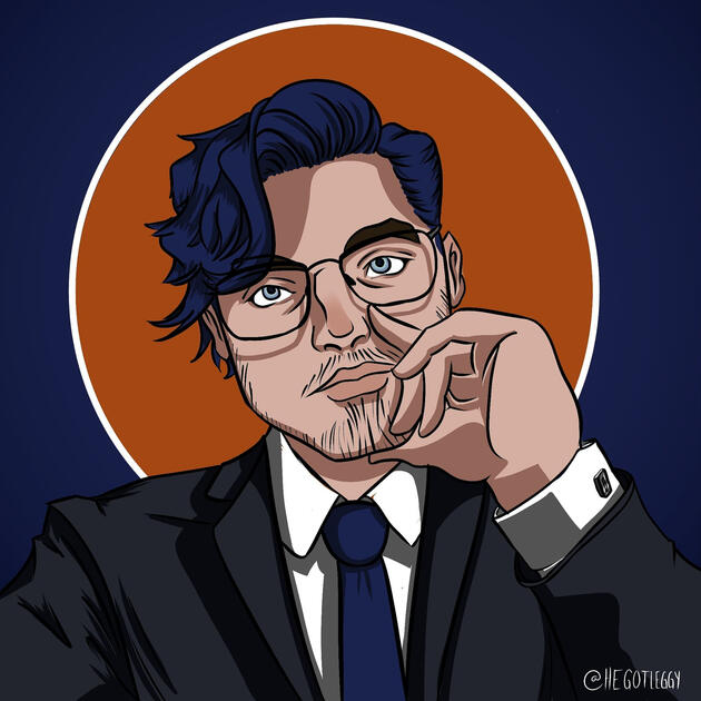 A cel-shaded self portrait with dark blue hair, grey eyes, and a faint beard. He is depicted wearing glasses, a black suit, a white french-cuffed shirt, and a blue tie. An orange circle with a white outline on a blue background frames his head.